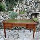 Elegant Louis XVI style mahogany flat desk from the 20th century