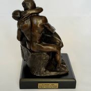 The bronze sculpture The Kiss, a reproduction of Rodin's statue, French sculpture.