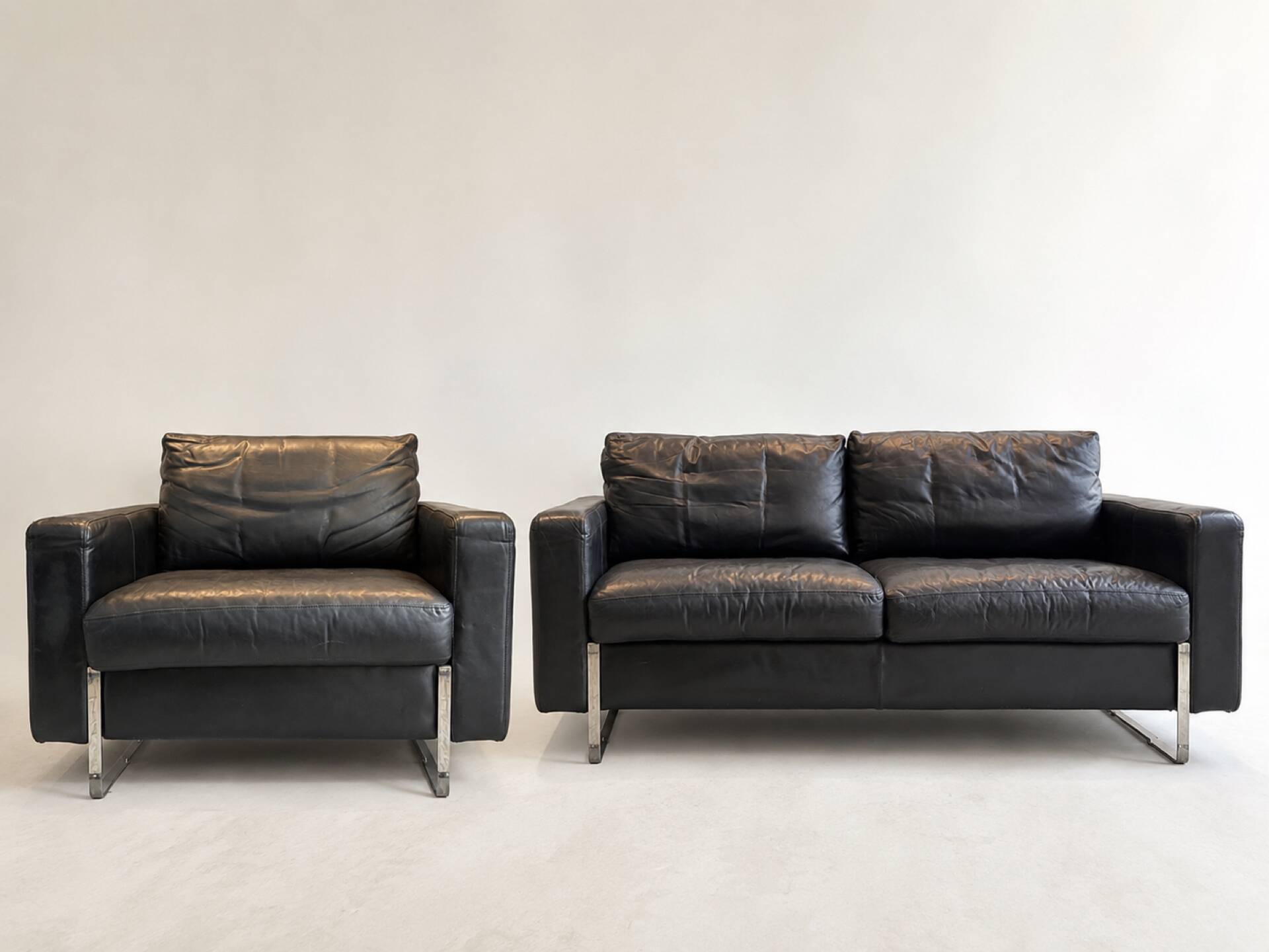 Set of (2) mid-century armchairs and a 2-seater sofa.