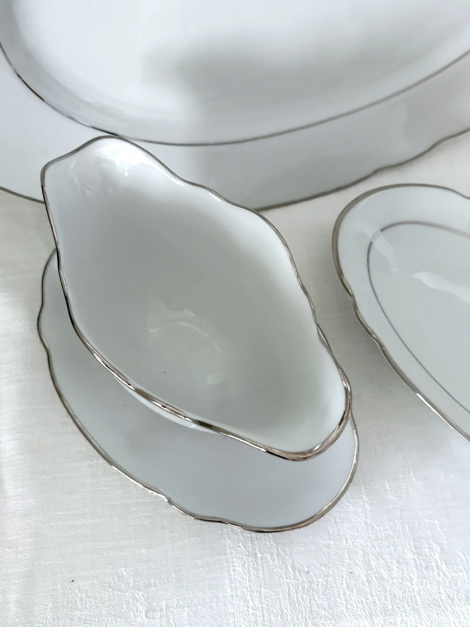 3 white porcelain plates