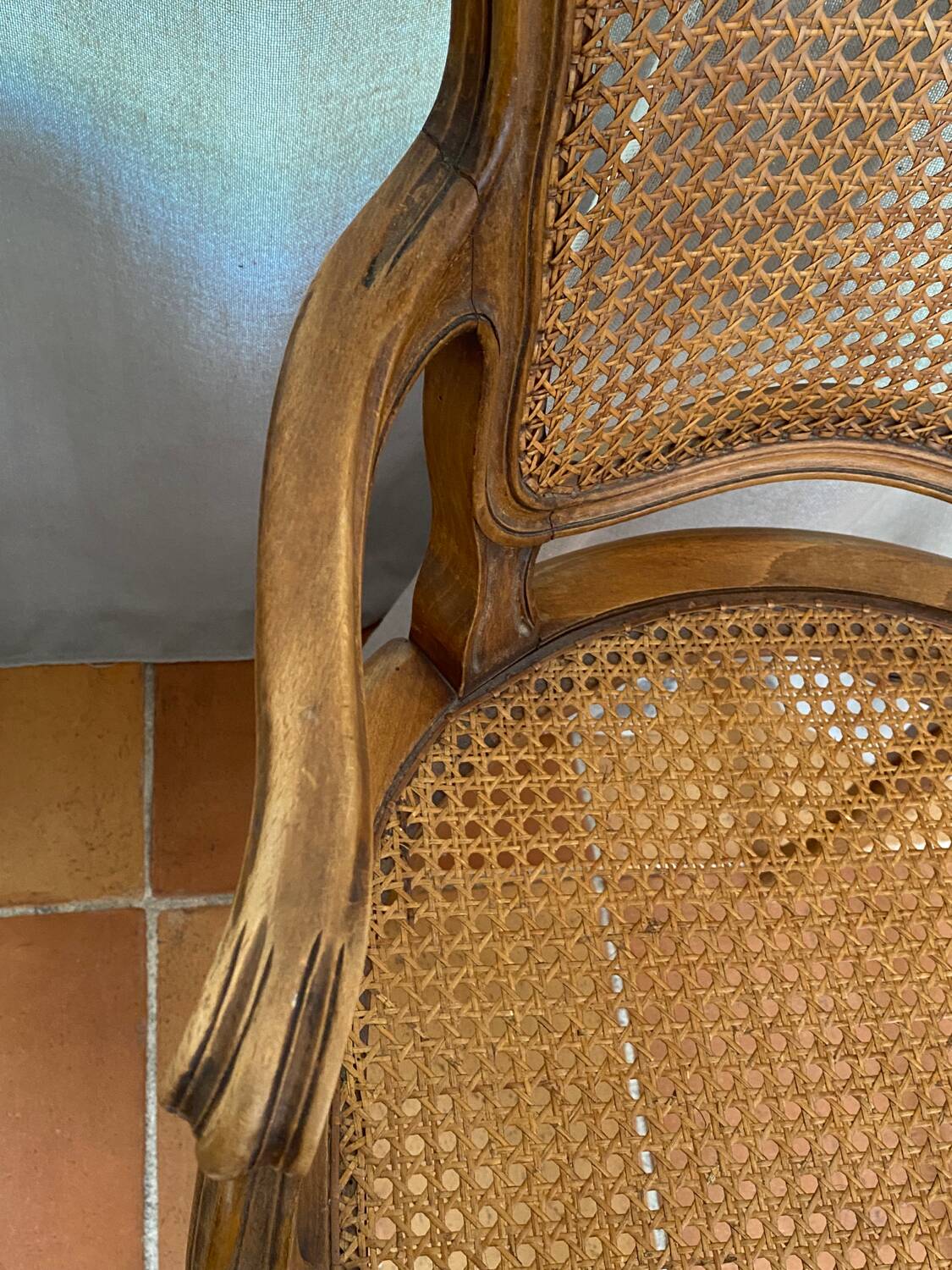 Louis XV style caned armchair