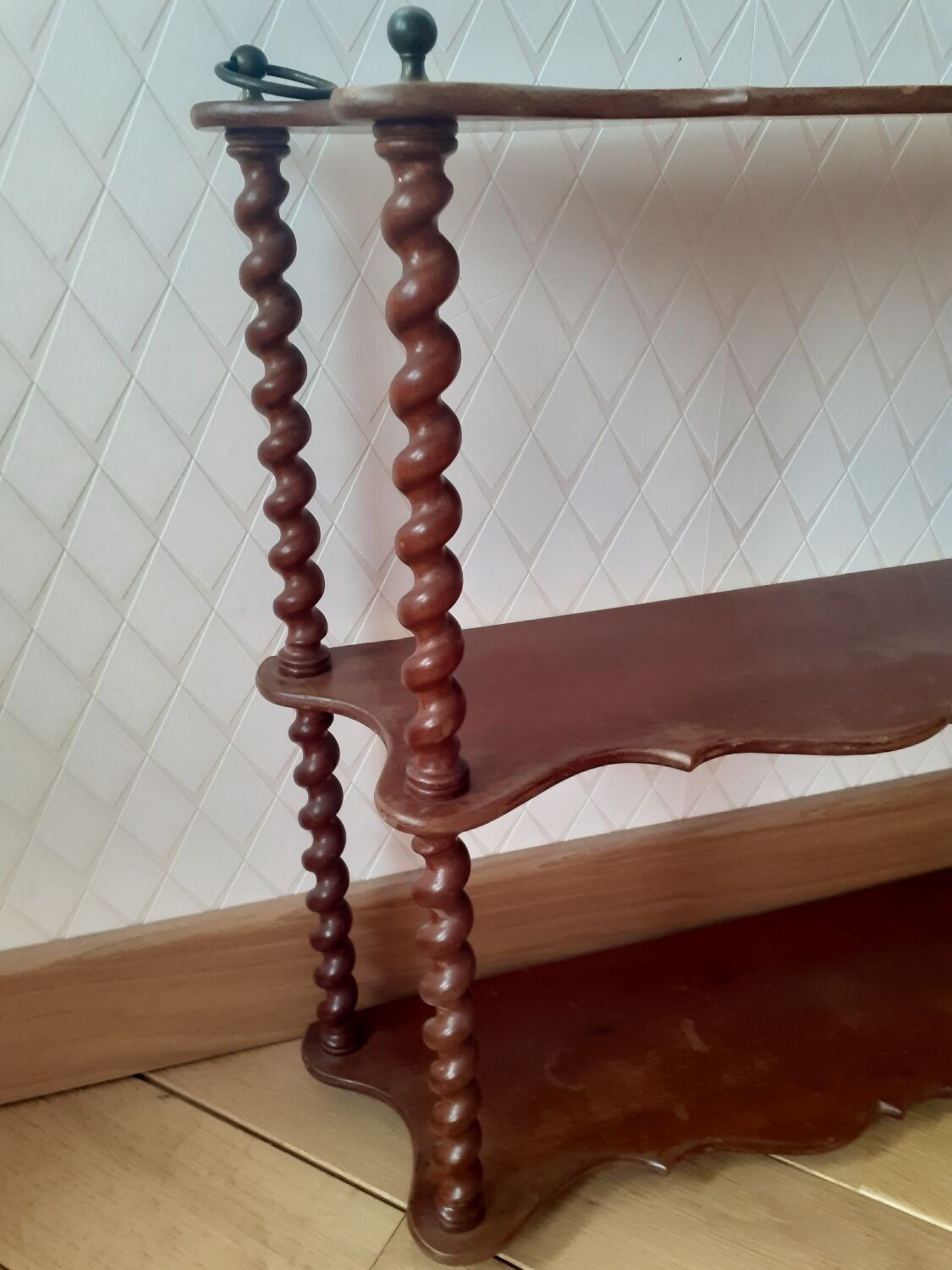 Turned wooden wall shelf