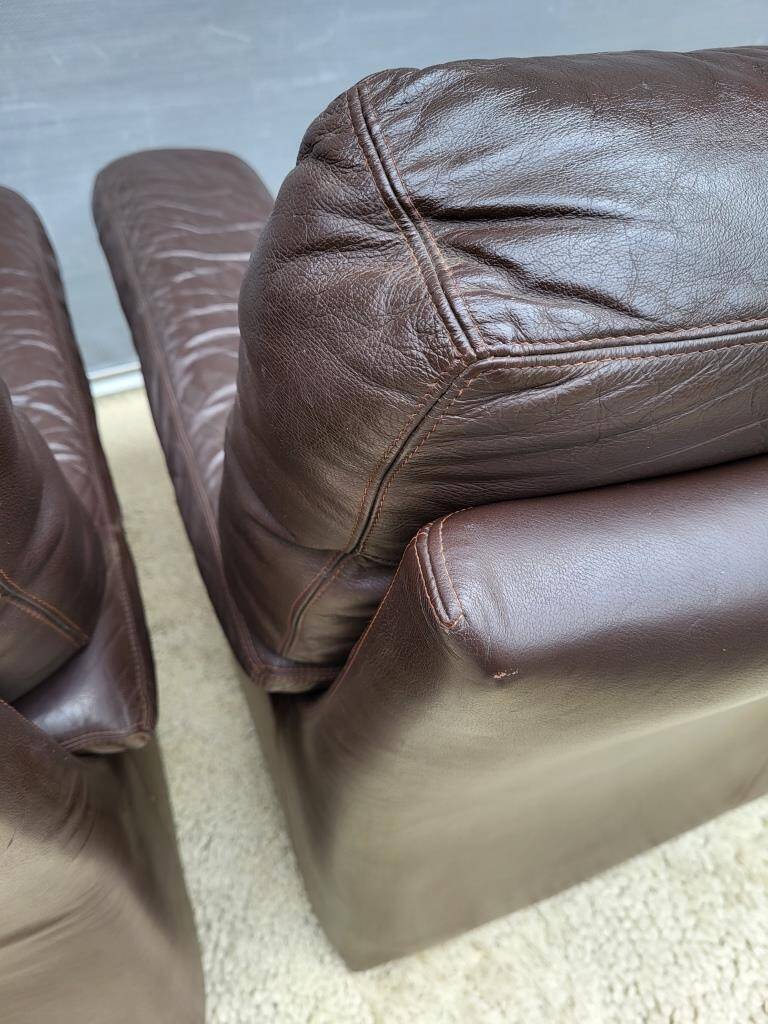 Pair of chocolate leather lounge chairs