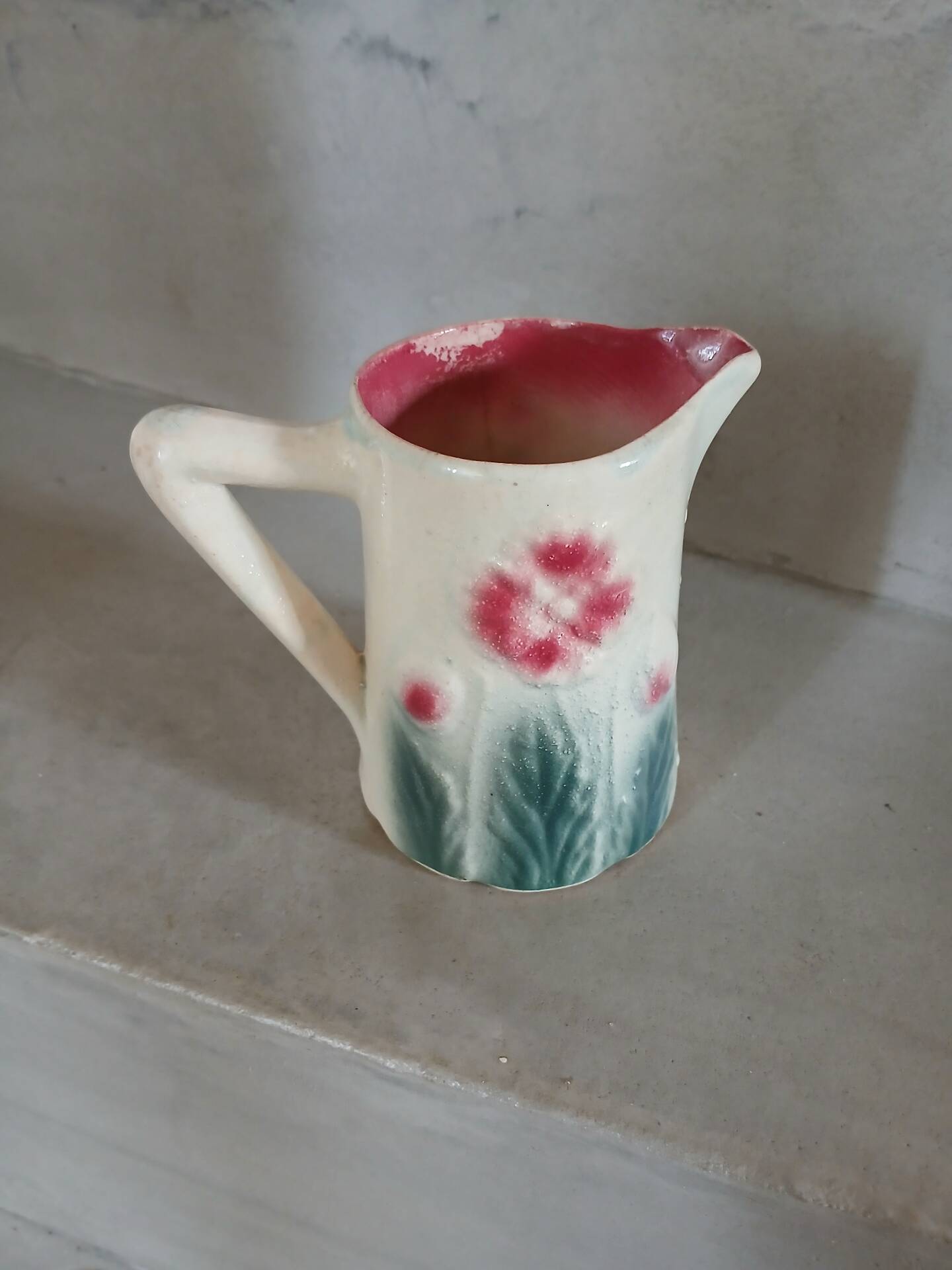Small antique jug in slipware.