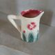 Small antique jug in slipware.