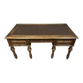 Renaissance style center desk with side pulls in carved walnut