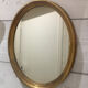 Golden oval mirror 26x32cm