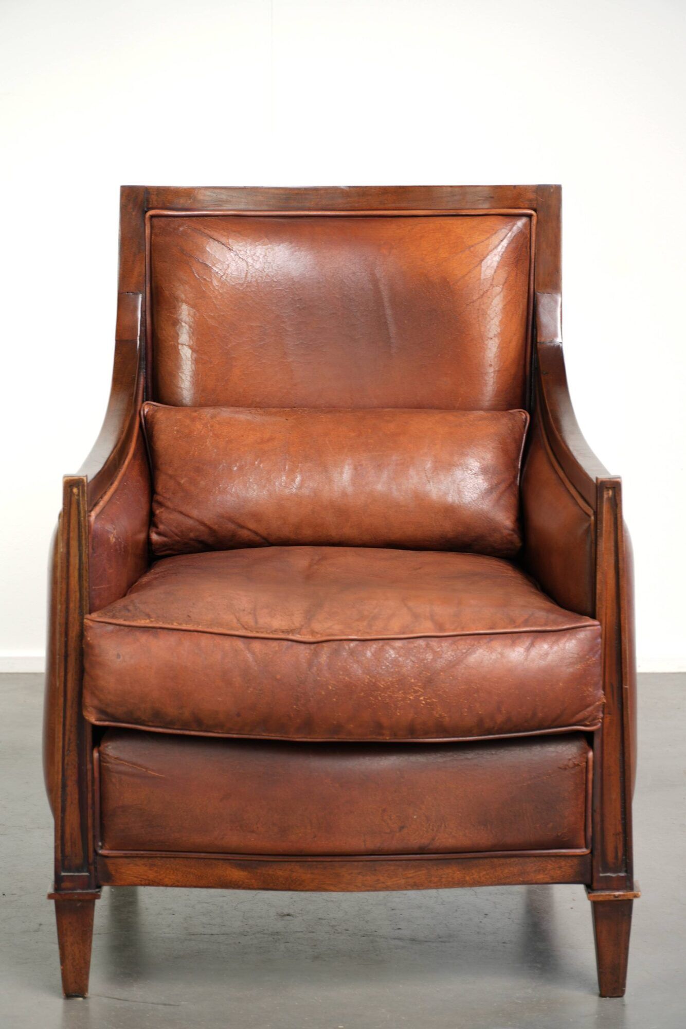 Sheepskin Art Deco design armchair with a comfortable seat and warm colours