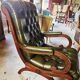 Pair of tufted leather armchairs in Chesterfield / English club style.