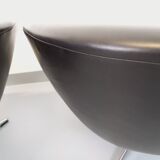 Pair of vintage Scandinavian swivel armchairs in faux leather and chrome.