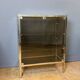 Chrome-plated brass display cabinet with smoked glass.