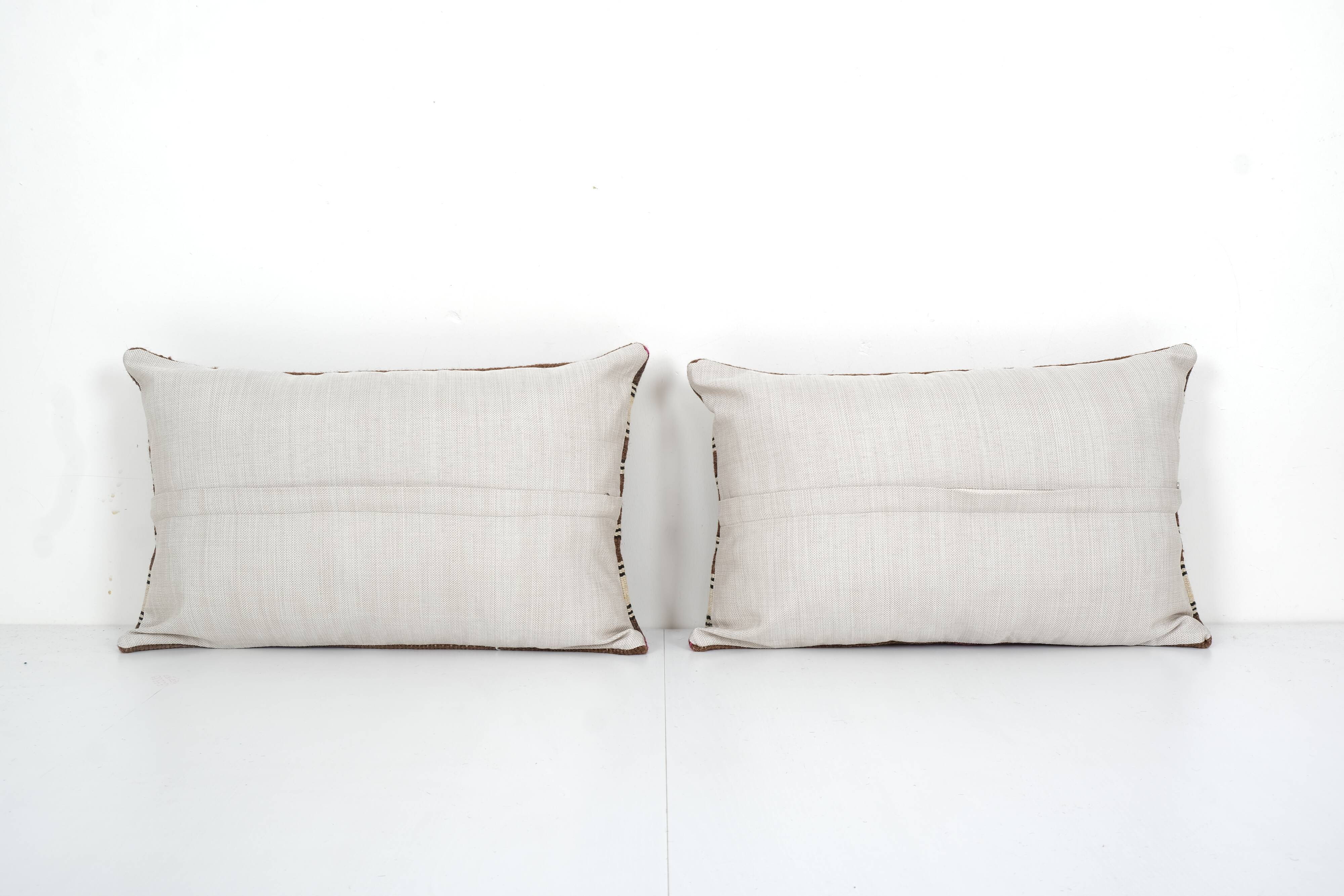 Kilim pillow cases made from a vintage anatolian handwoven textile - matching oblong lumbar brown