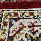 Tapis vintage en laine et frange