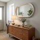 Oval mirror in white lacquer from the 1970s.