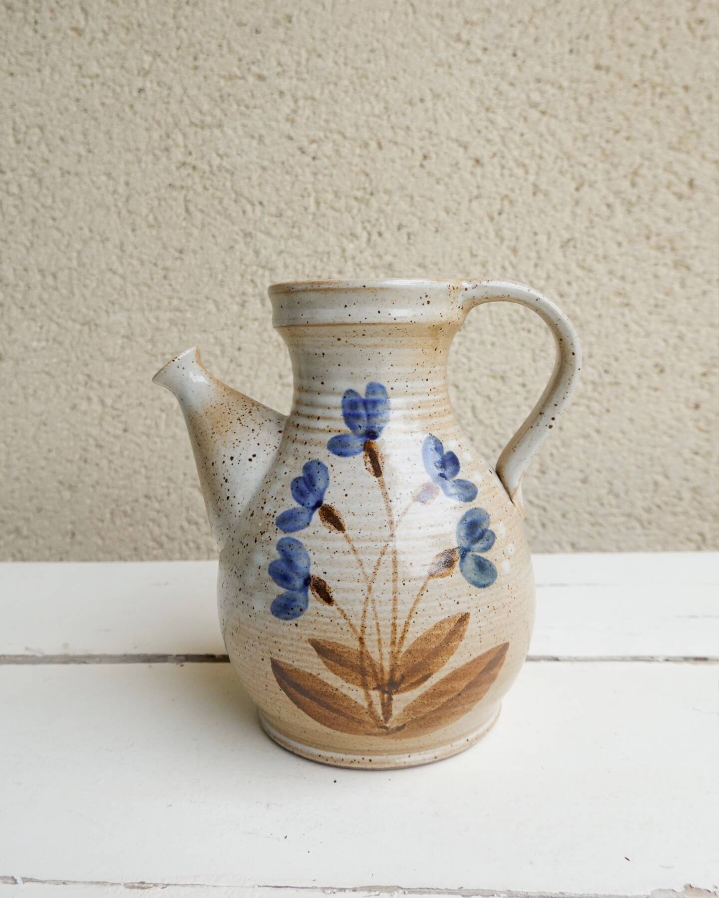 Marais stoneware pitcher, floral decoration