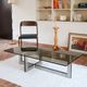 Smoked glass coffee table, brushed stainless steel base, 1970s.
