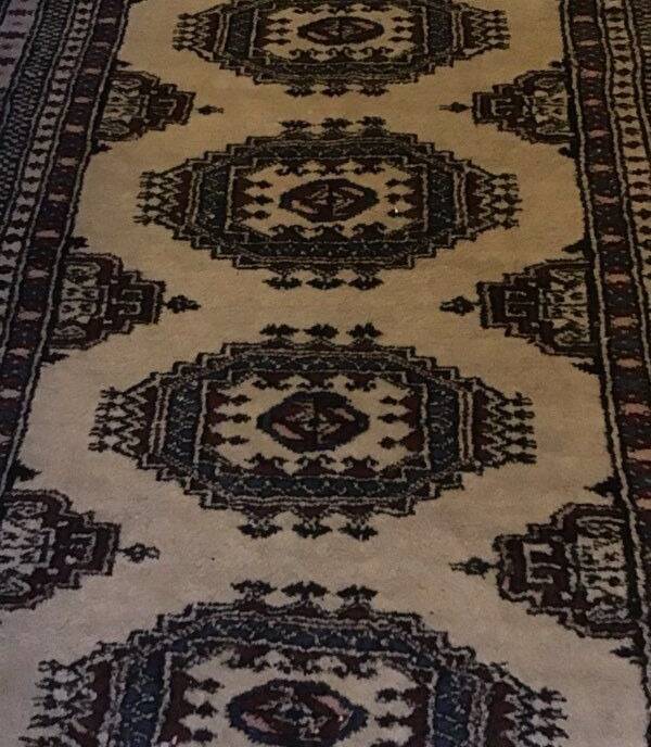 Vintage rug with oriental and geometric patterns, fringes, 63 × 90 cm