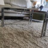 Round coffee table in smoked glass with chrome legs