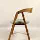 Vintage dining chair in light oak with natural linen pastel green fabric.