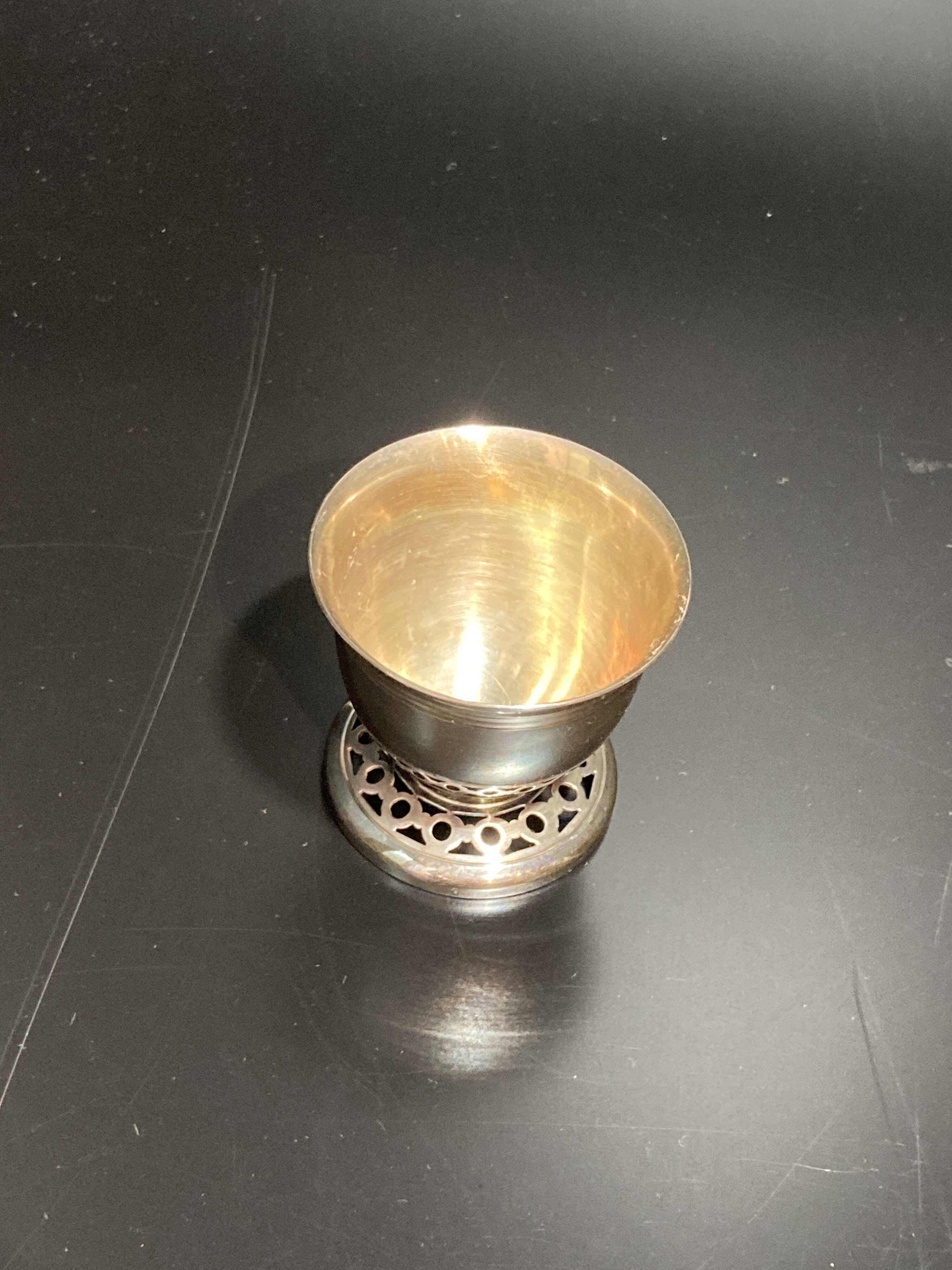 Egg cup with silver metal spoon