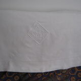 Old sheet in monogram white thread