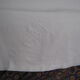 Old sheet in monogram white thread