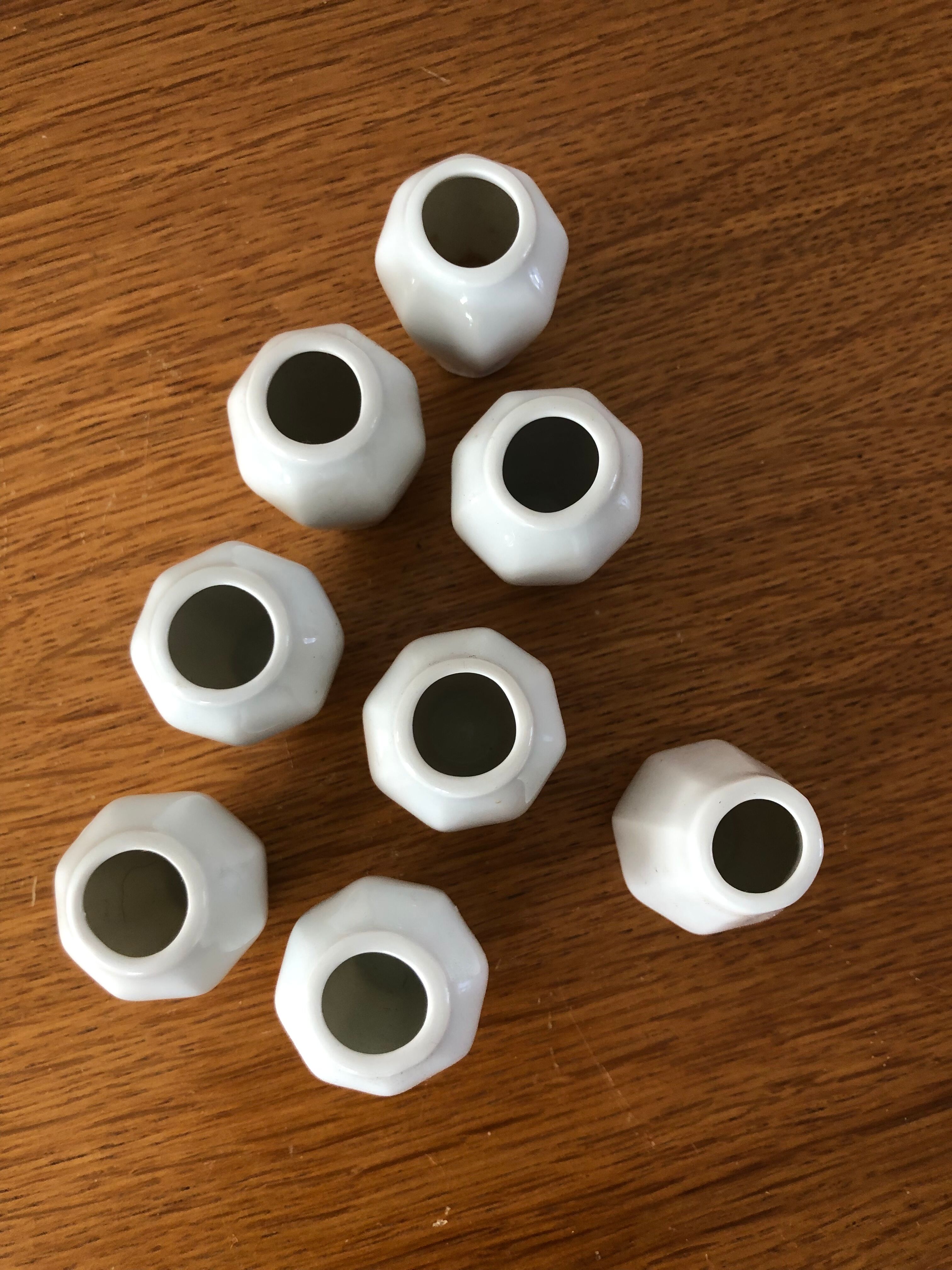 8 miniature vases in white earthenware