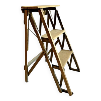 Old small painter's stepladder, wooden trade furniture, step stool