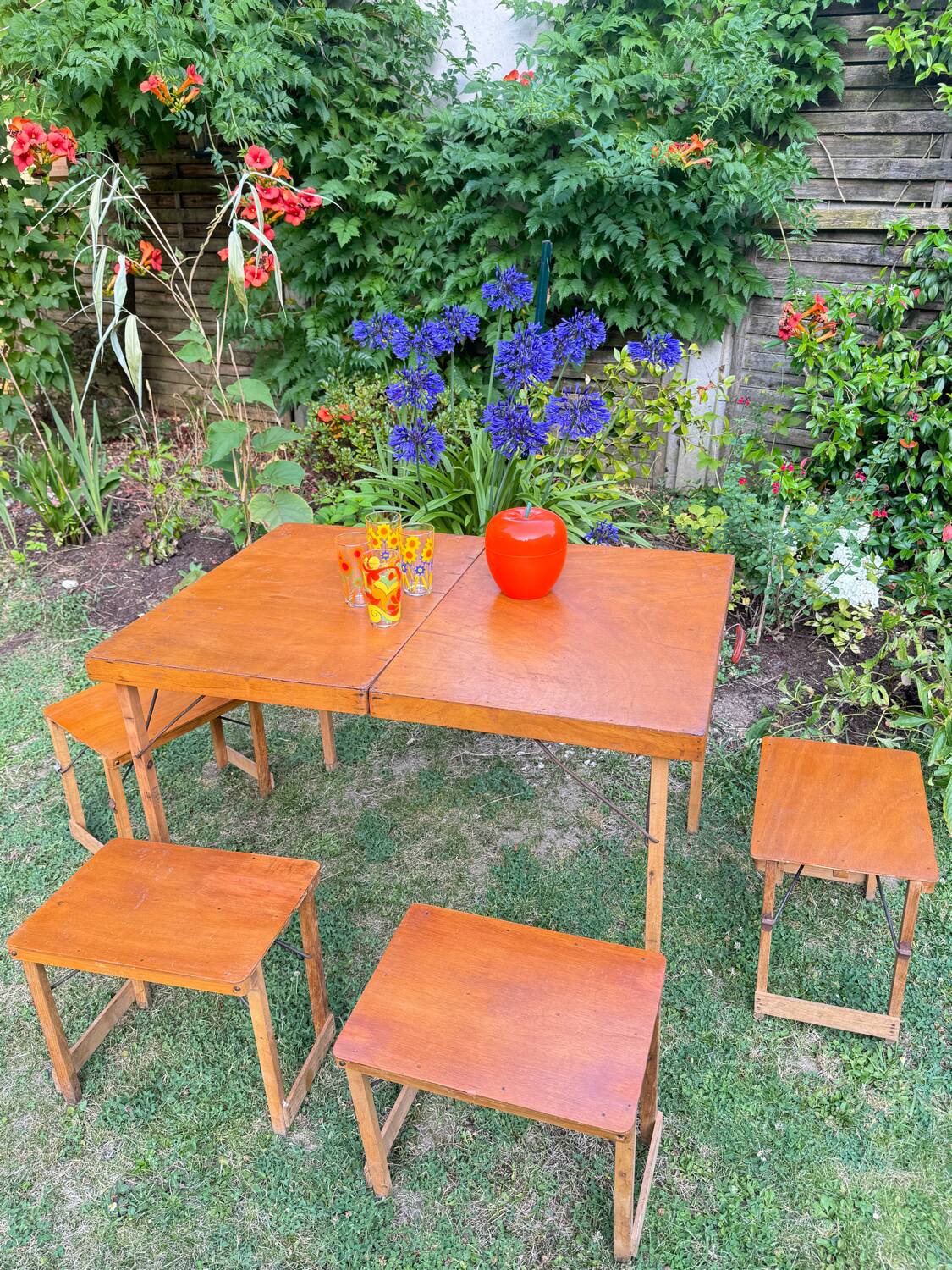 Old suitcase, table and stools, vintage wooden picnic