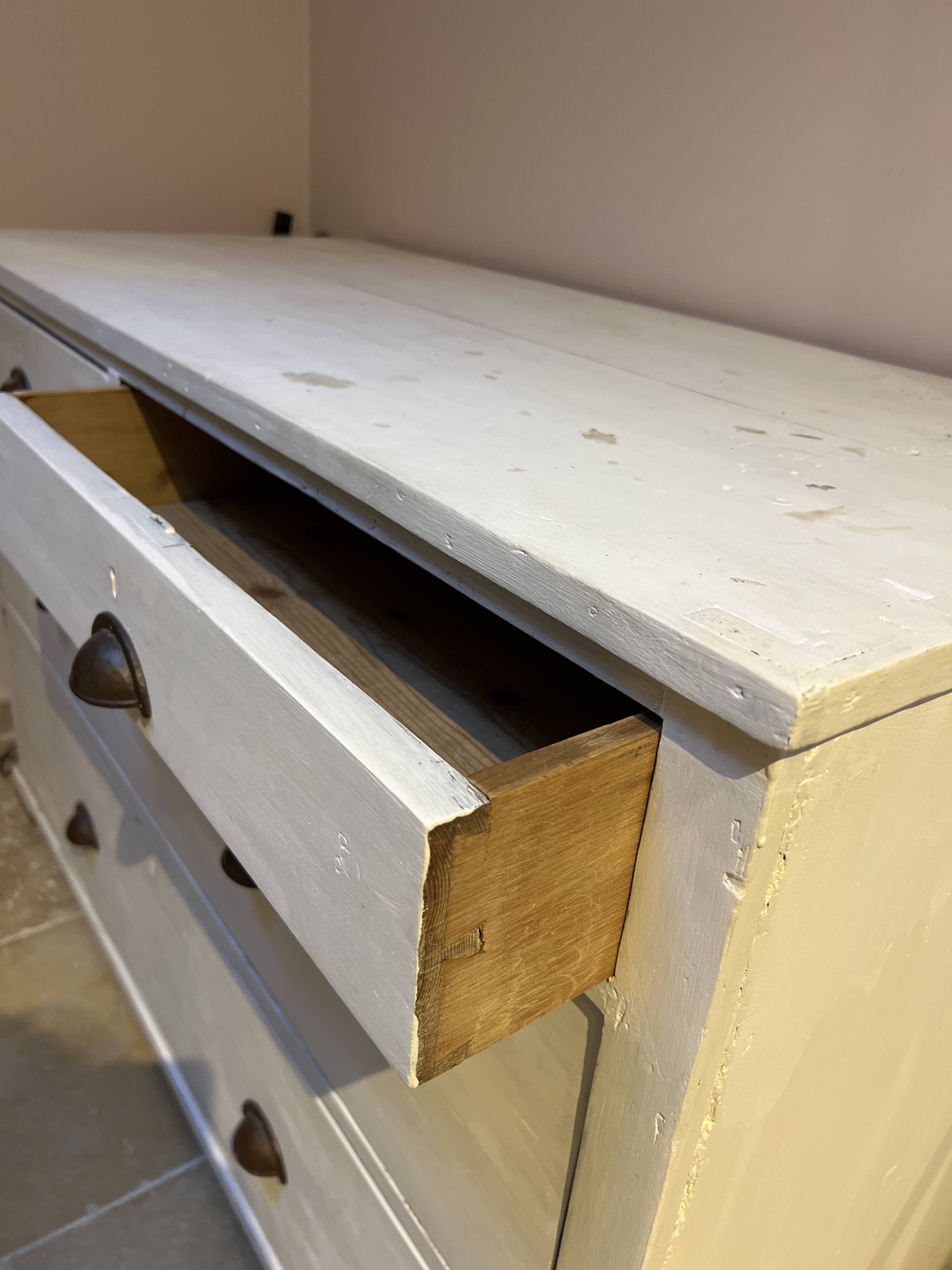 Sturdy antique sideboard with solid wood and drawers.
