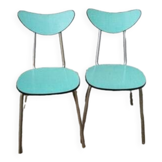 pair of green formica chairs