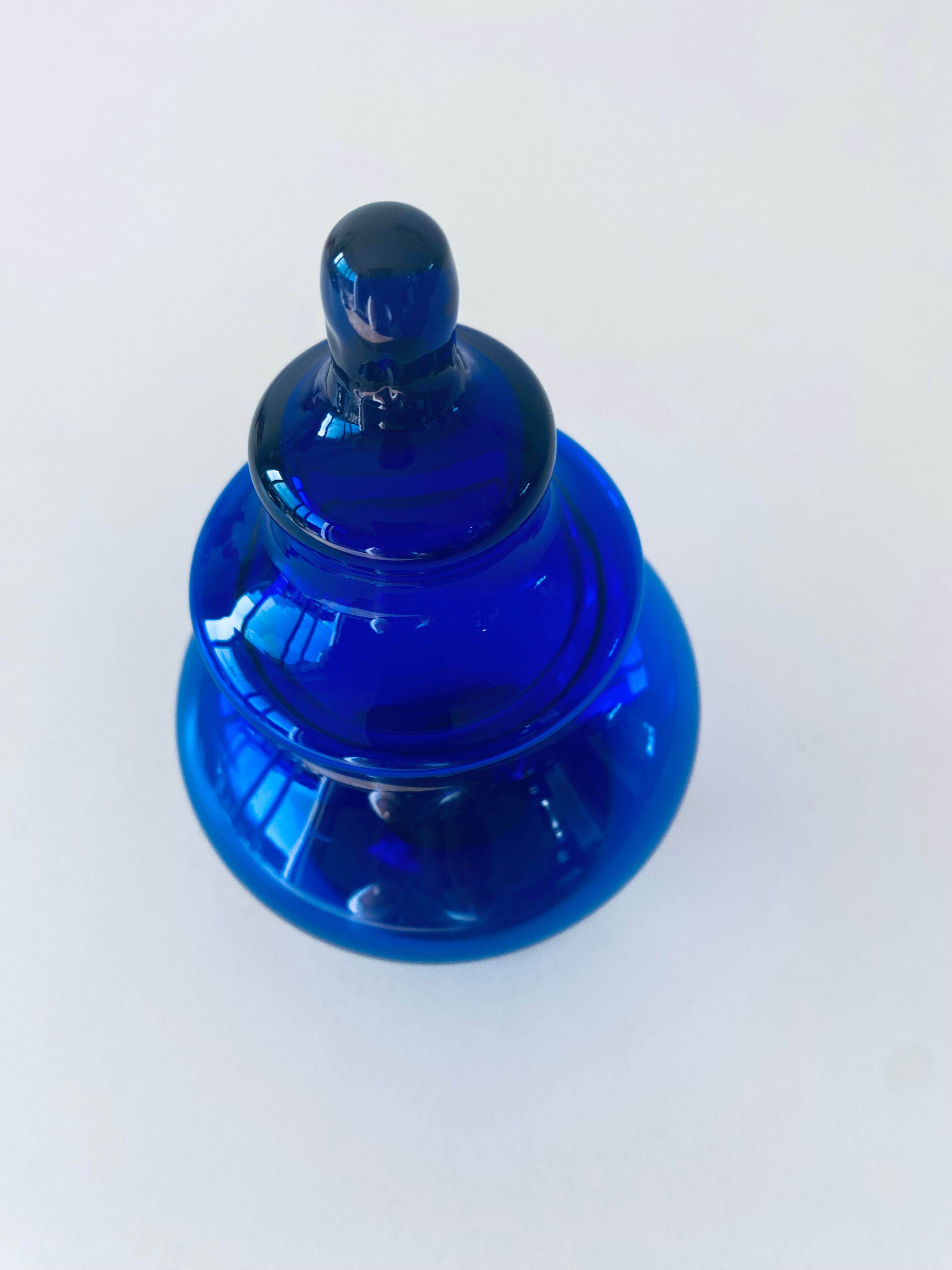 Blue glass apothecary shaped bottle