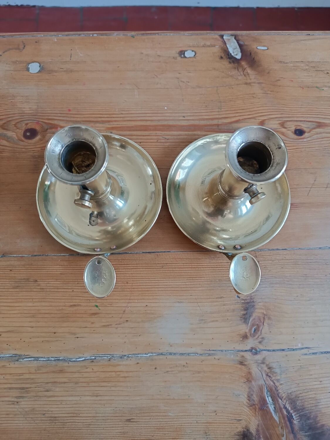 Duo of gilded brass cellar rat candlesticks