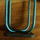 Industrial stool sitting wood feet metal blue metal feet