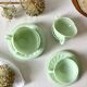 Pressed glass cups and saucers, 1950s