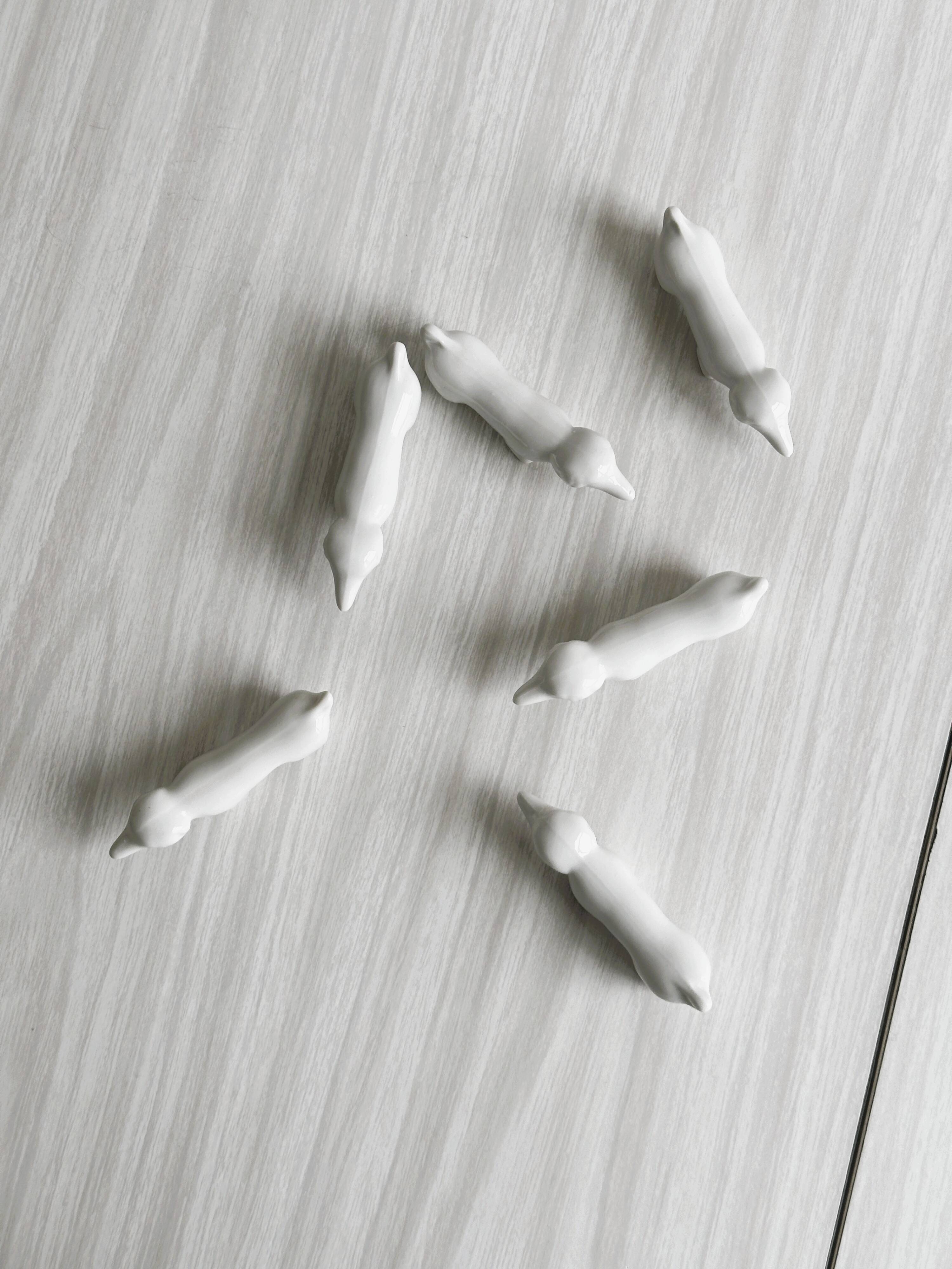6 vintage white porcelain knife rests