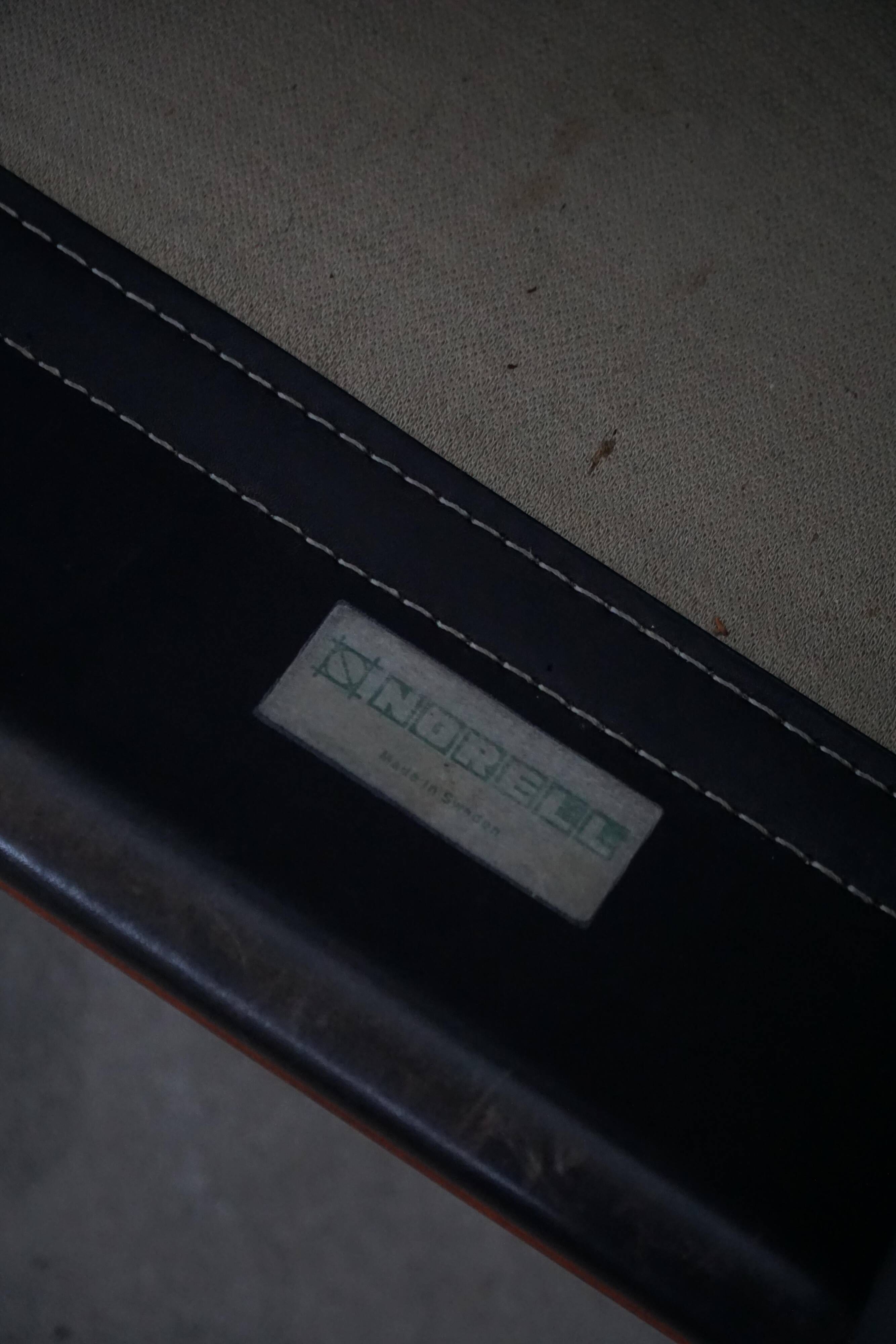 "Lounge chair 'Ilona' by Arne Norell in stained beech and leather, mid-20th century."