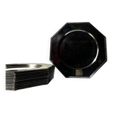 Many octagonal presentation plates in silver-plated metal.