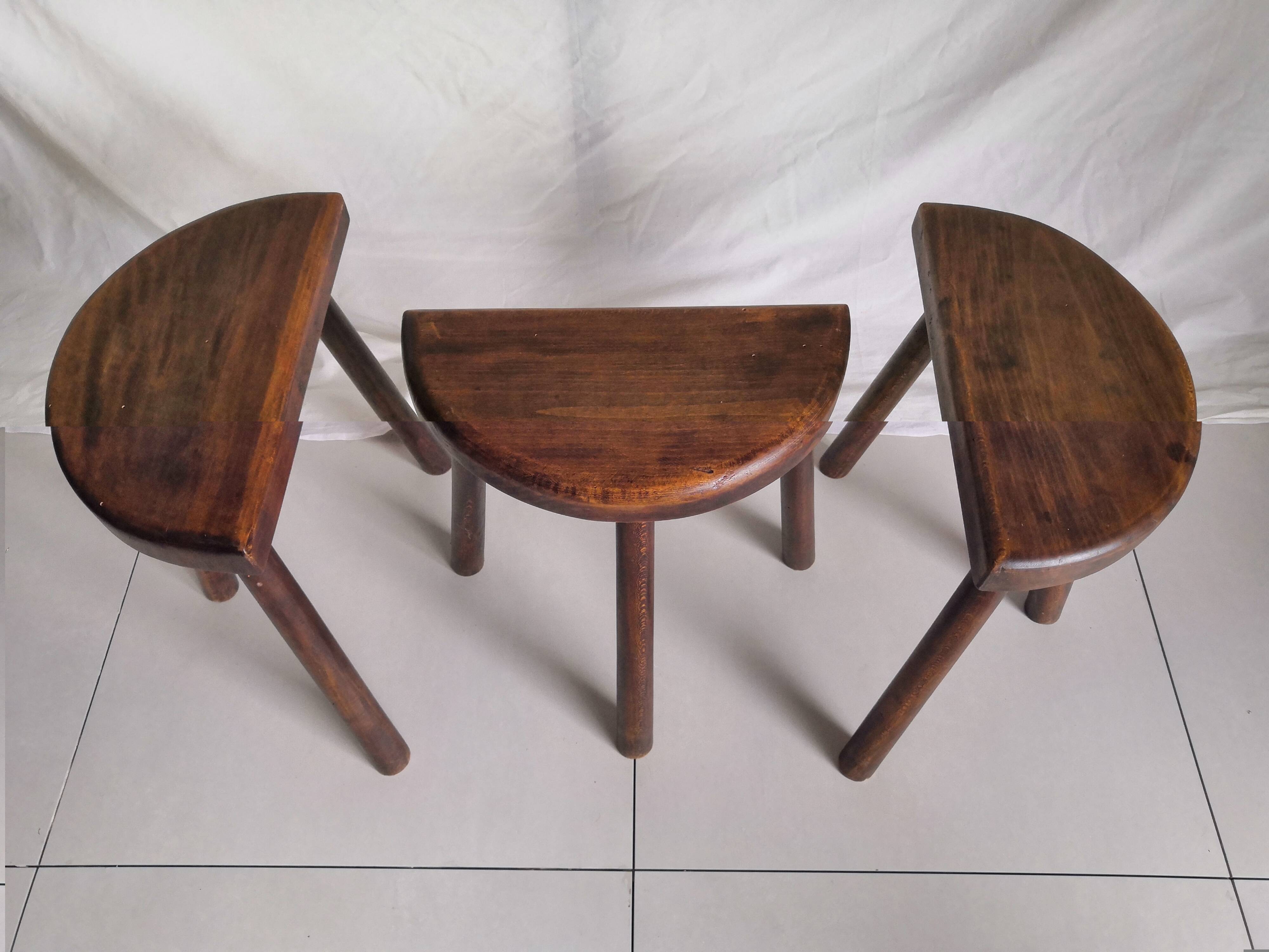 Trio of vintage brutalist tripod stools