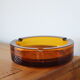 Round vintage amber glass ashtray