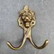 Antique brass lion coat hook