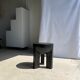 Black mango wood tripod side table with a semi-spherical top, height: 45 cm, diameter: 44 cm.