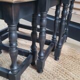 Nest tables in wood and black.