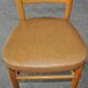 Vintage chair in brown faux leather and light wood, 1960s, padded seat.