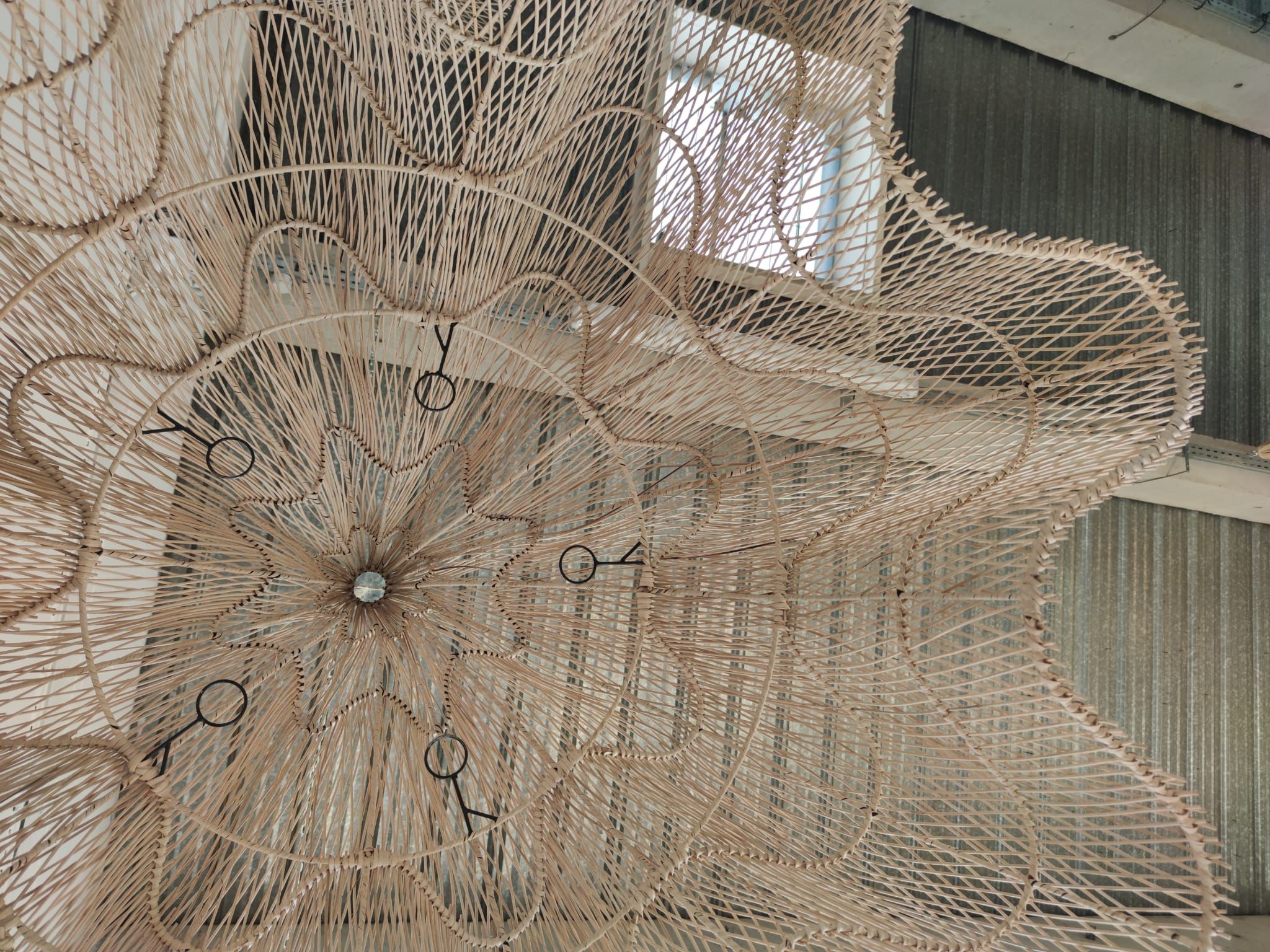 Huge rattan suspension in the shape of a corolla H:1m; D: 1m50