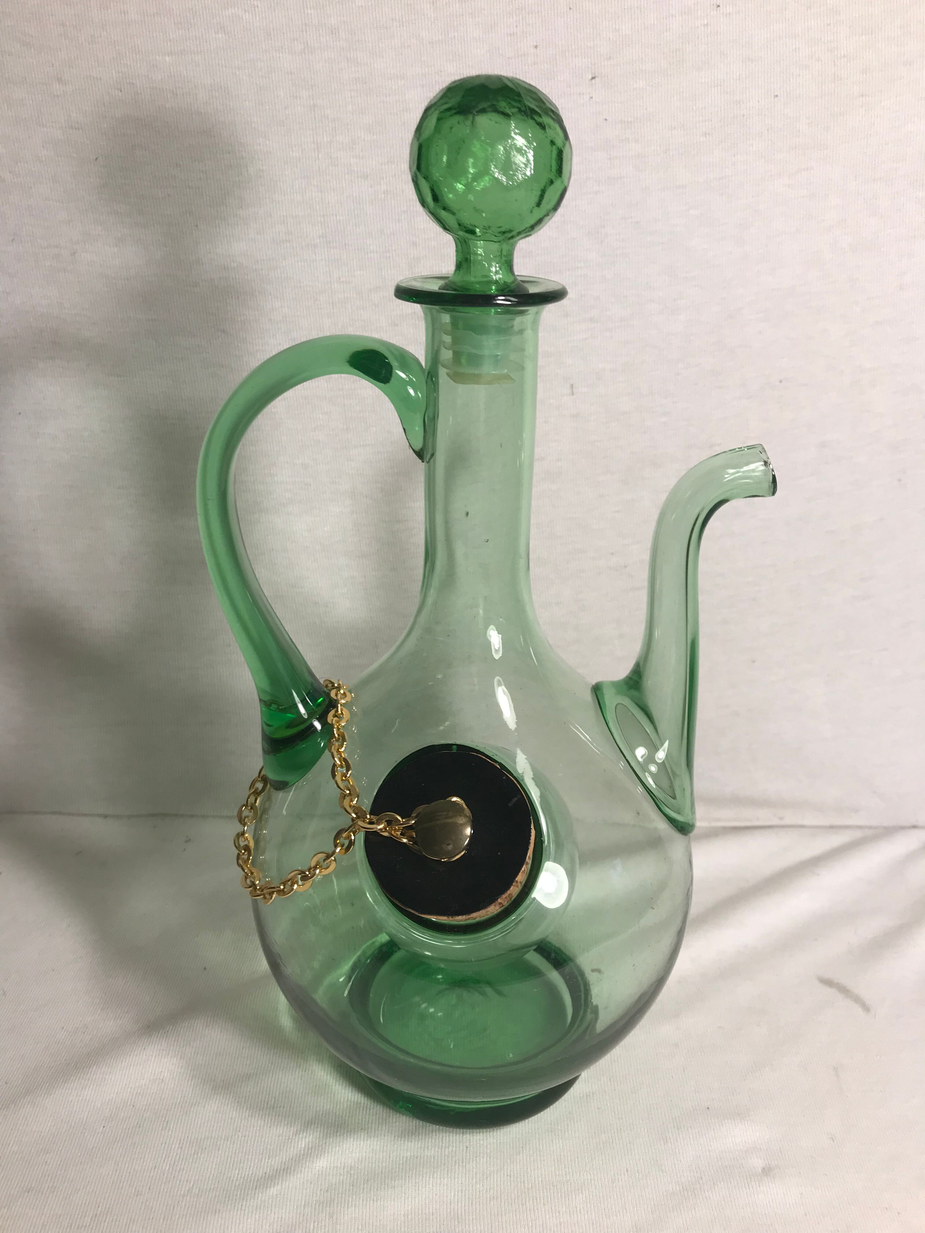 Old refreshing carafe pourer in green blown glass with vintage cap
