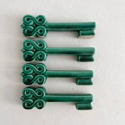 4 green ceramic knife rests in vintage key shape