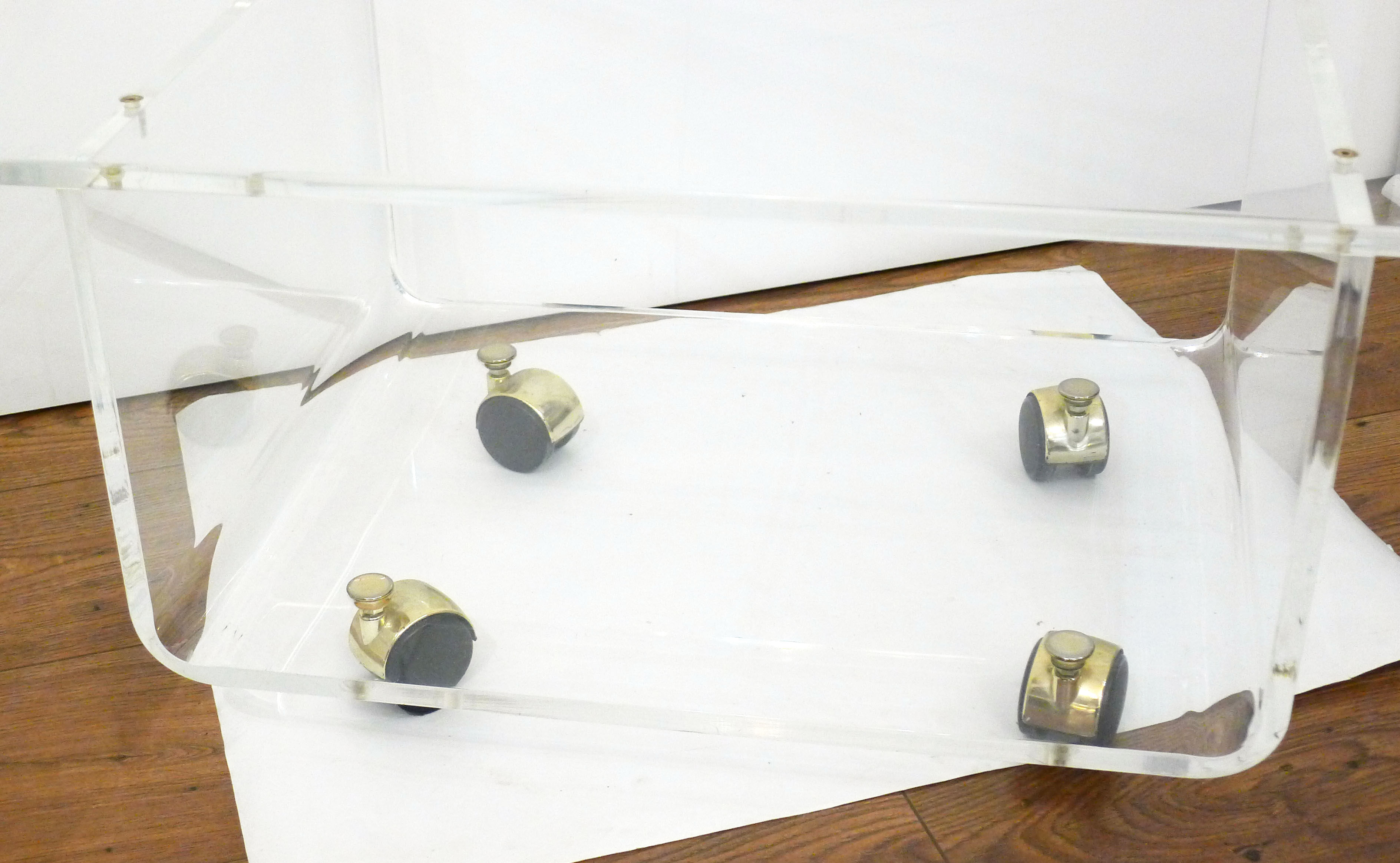 Transparent thermoformed plexi coffee table, on wheels