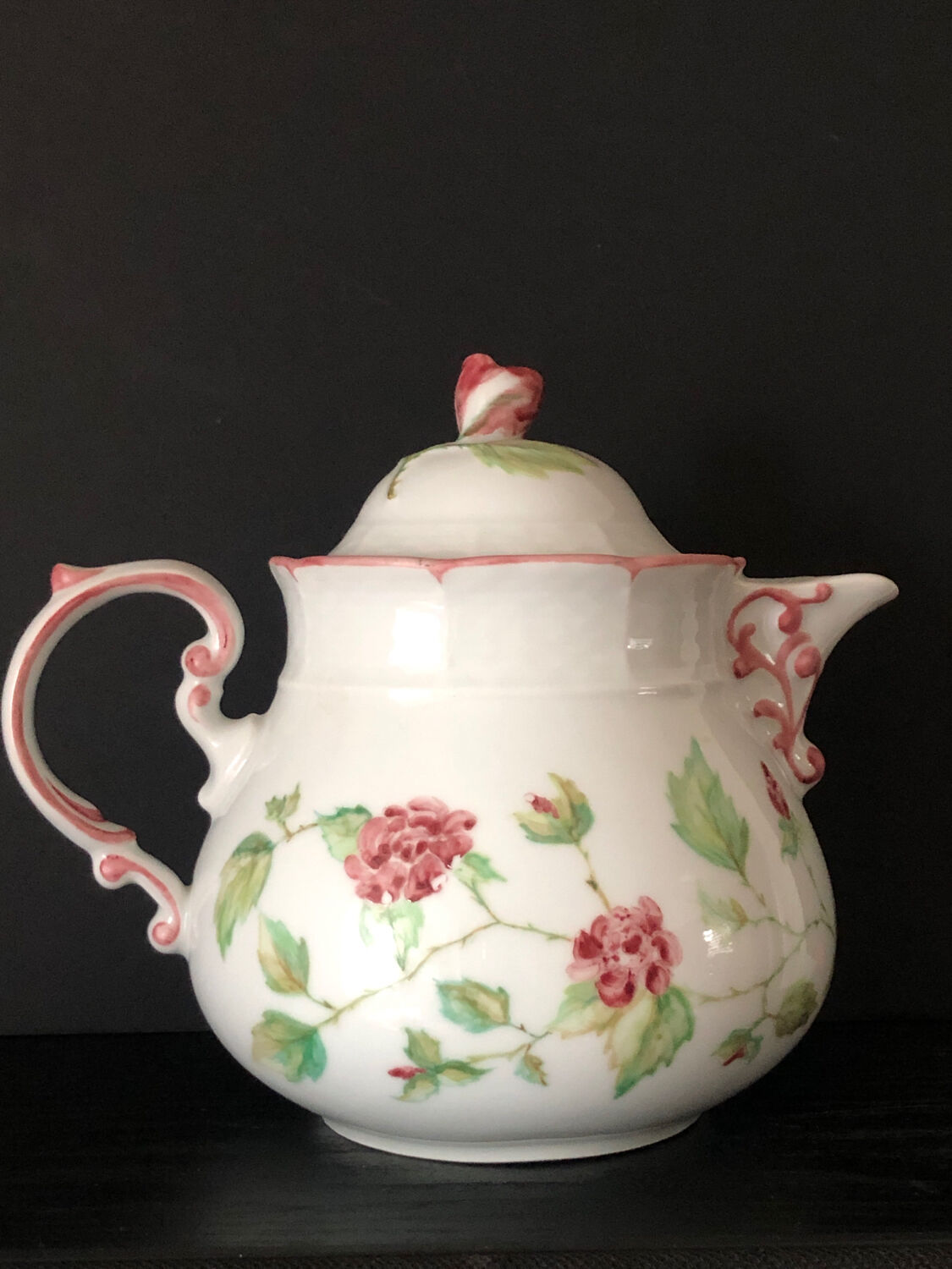 Old white and pink teapot