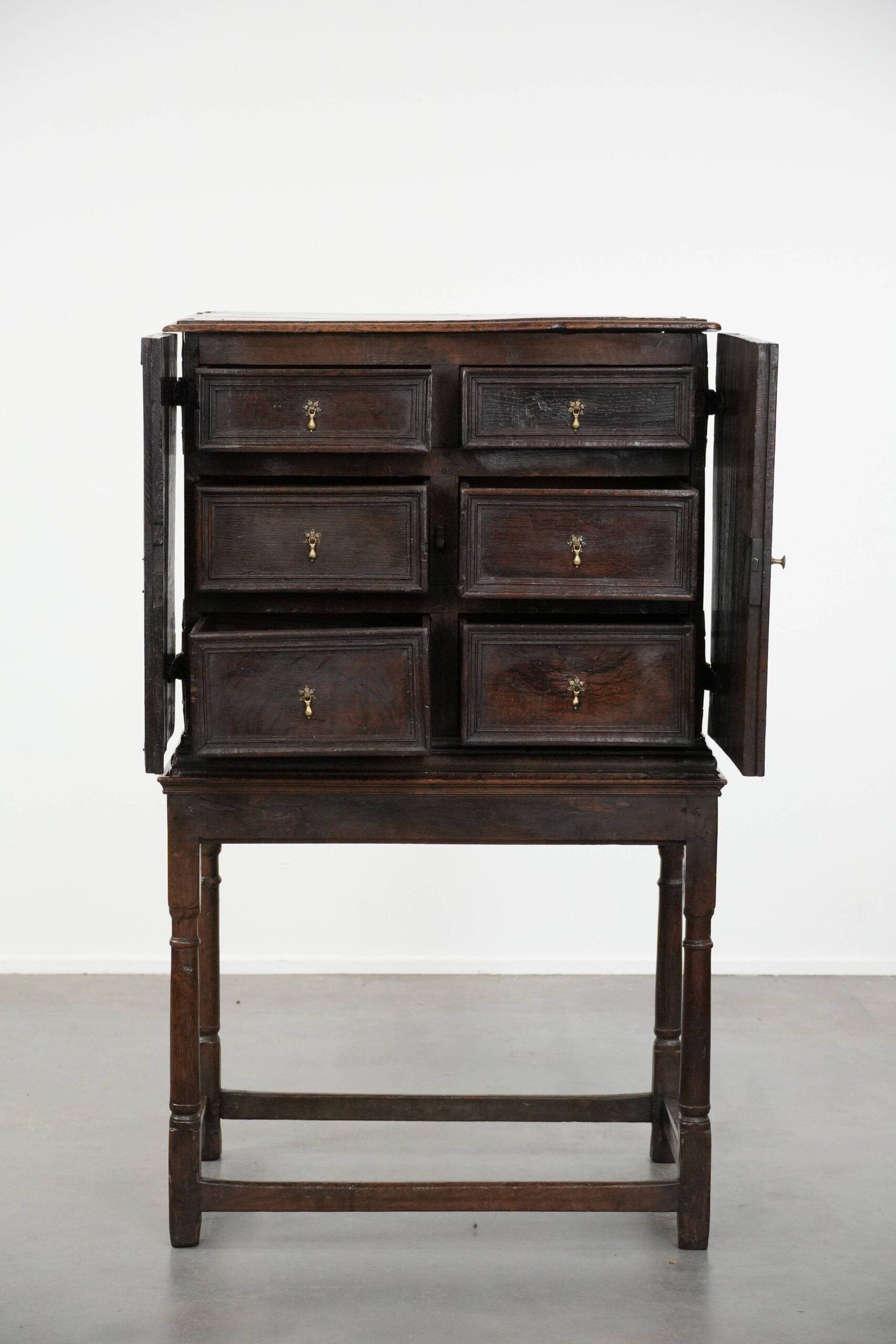 Unique antique English cabinet on stand made of oak from the 17th century